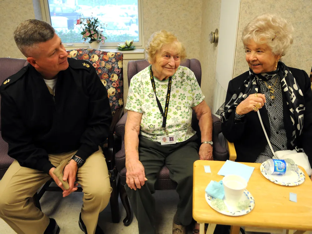 Older adults in warm conversation at a residential retirement home